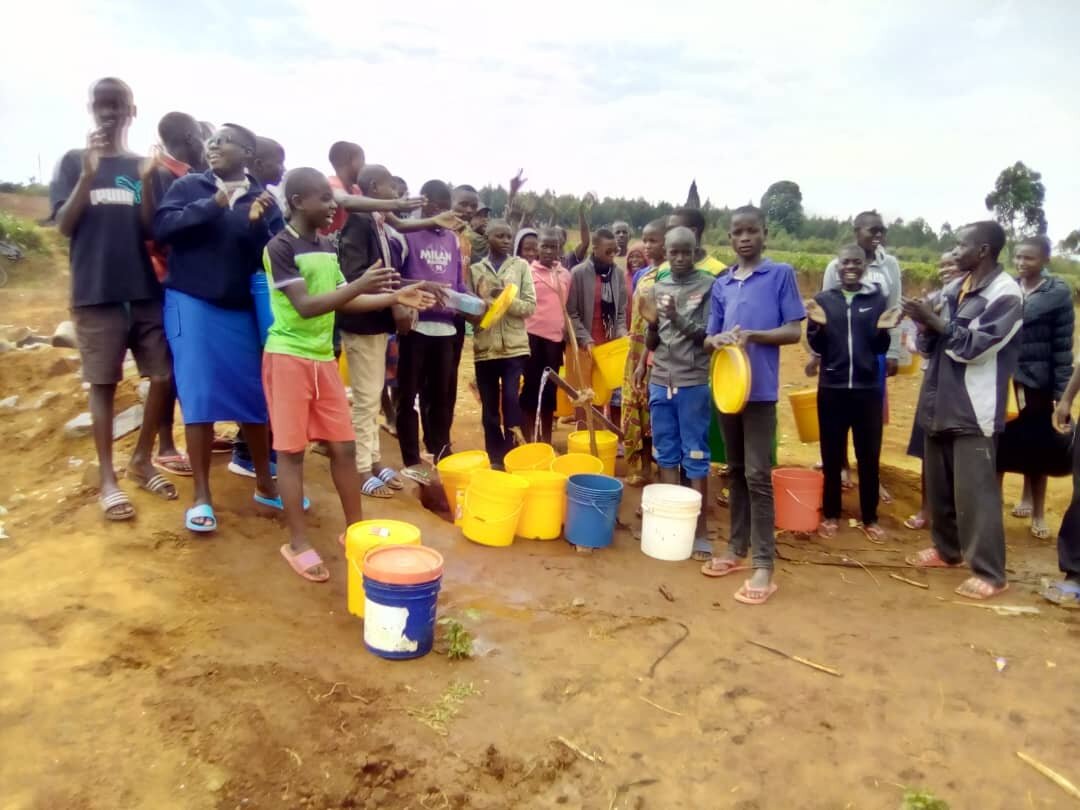 The students at Rubanga high school are very happy to get clean water.jpg