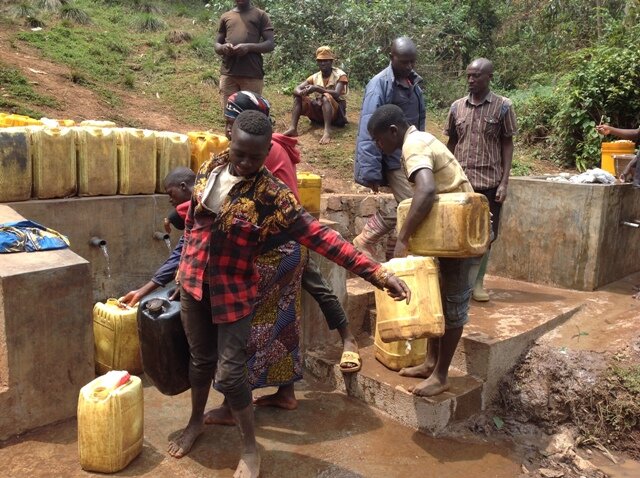 The people are fetching clean water at the source.JPG