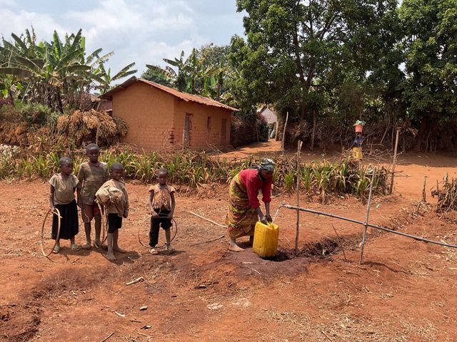 The women fetching clean water.JPG