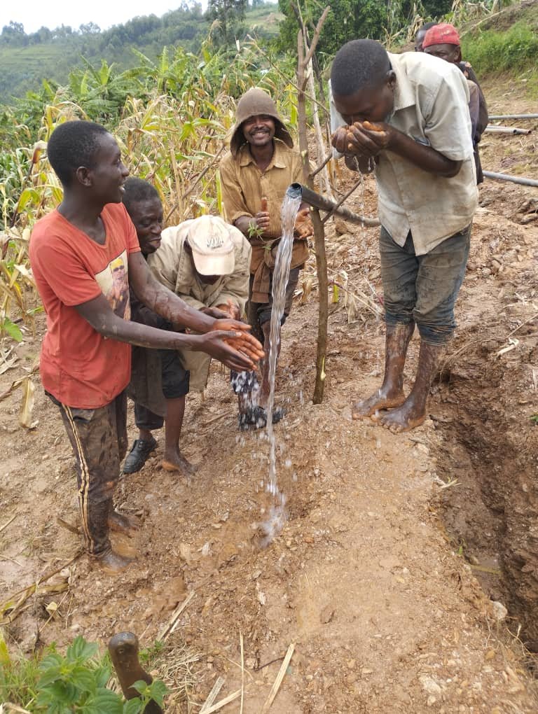 They are happy to get clean water.jpg
