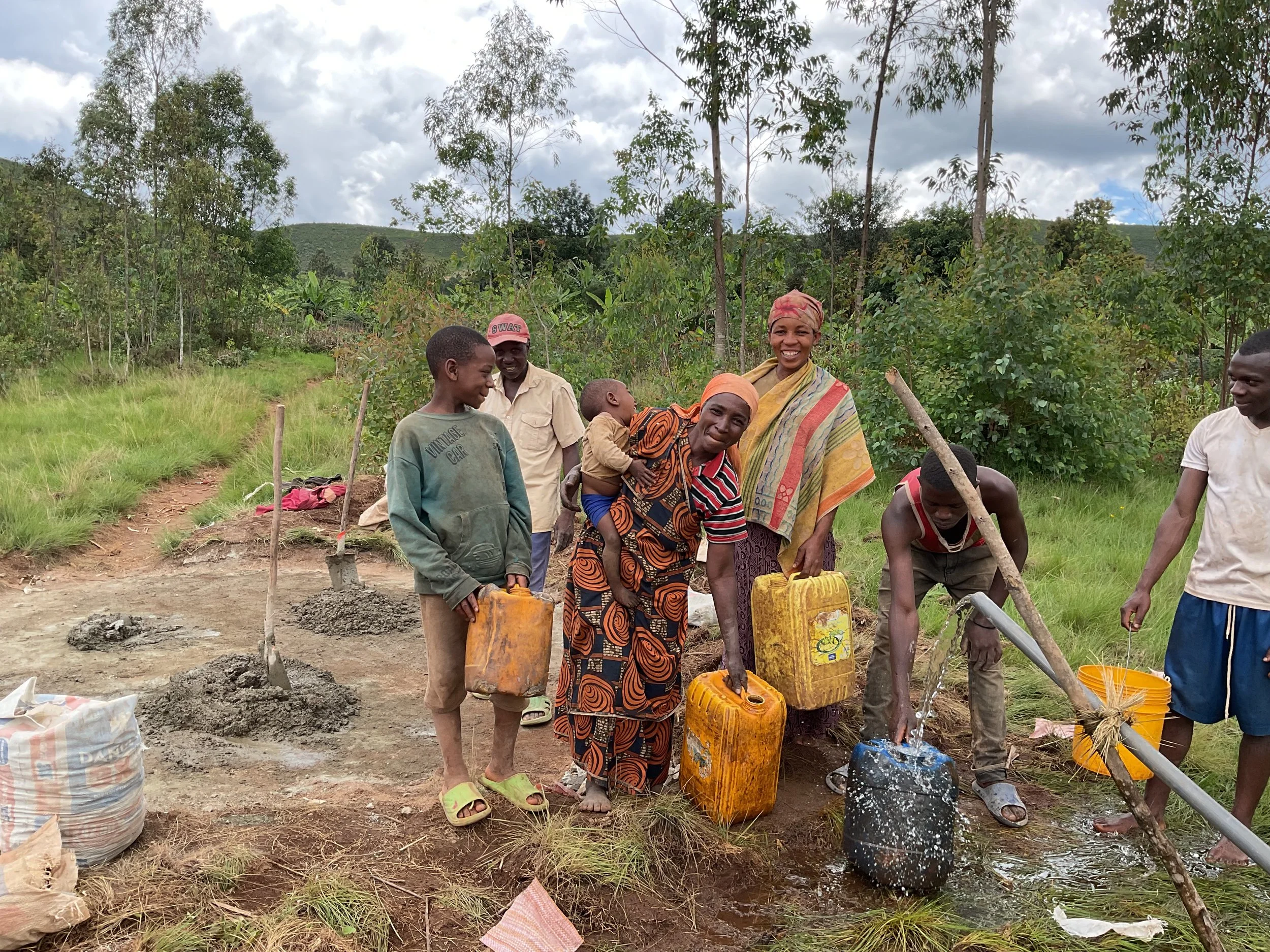 The people are happy to get clean water.JPG