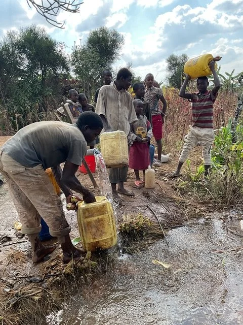 They are fetching water on pipeline.JPG