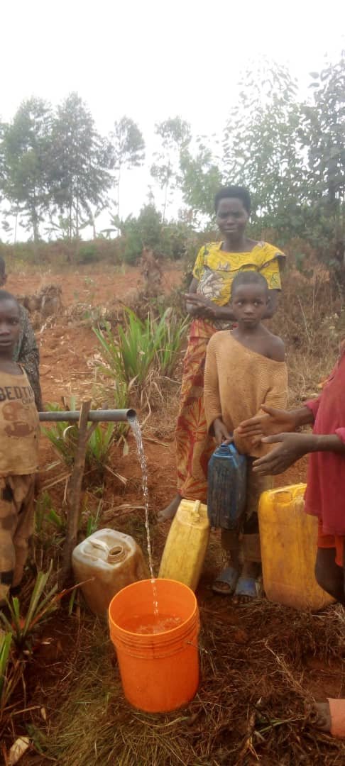 They are fetching clean water on pipeline.jpg