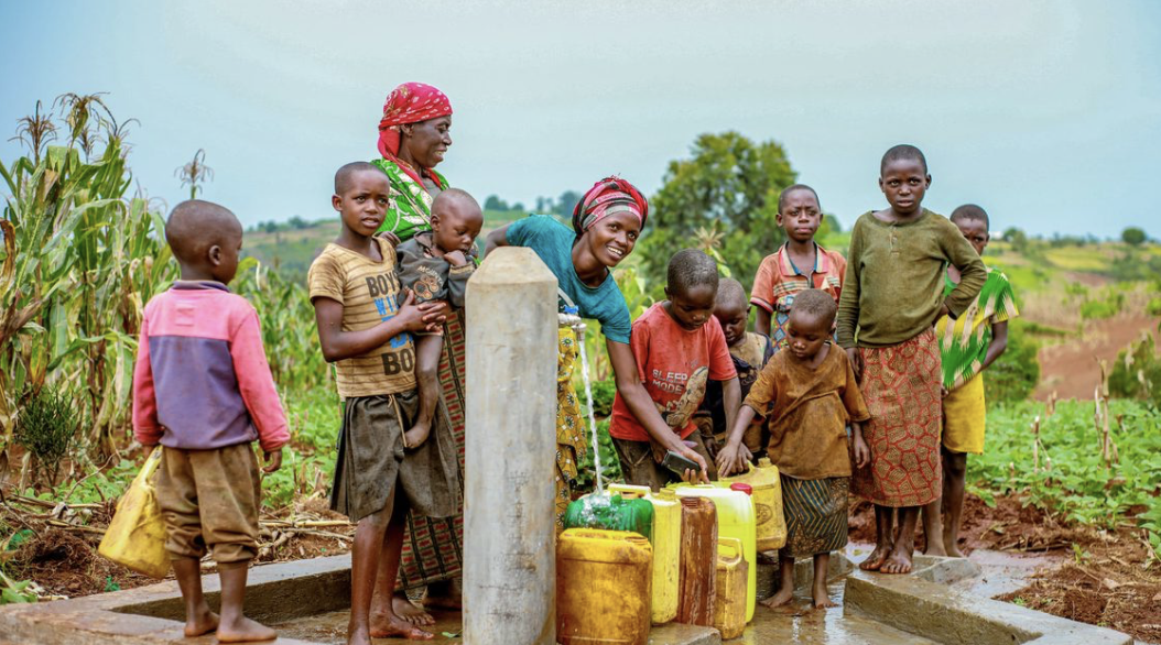 children at gazelle foundation tap stand accessing clean water