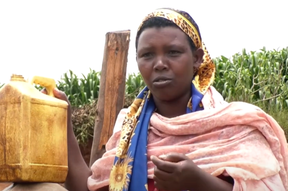 Woman at tap stand build by gazelle foundation