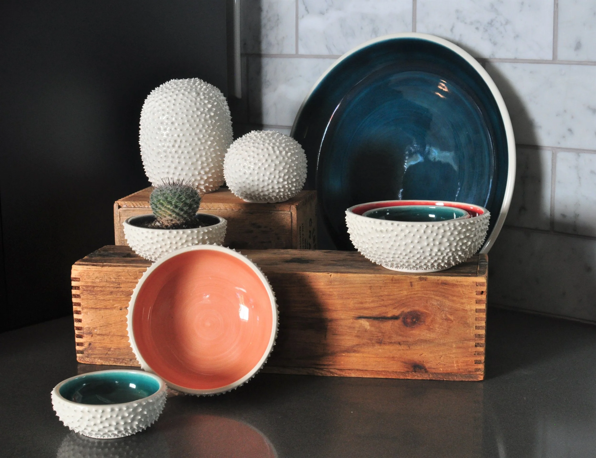 Spike vases and bowls with large peacock plate