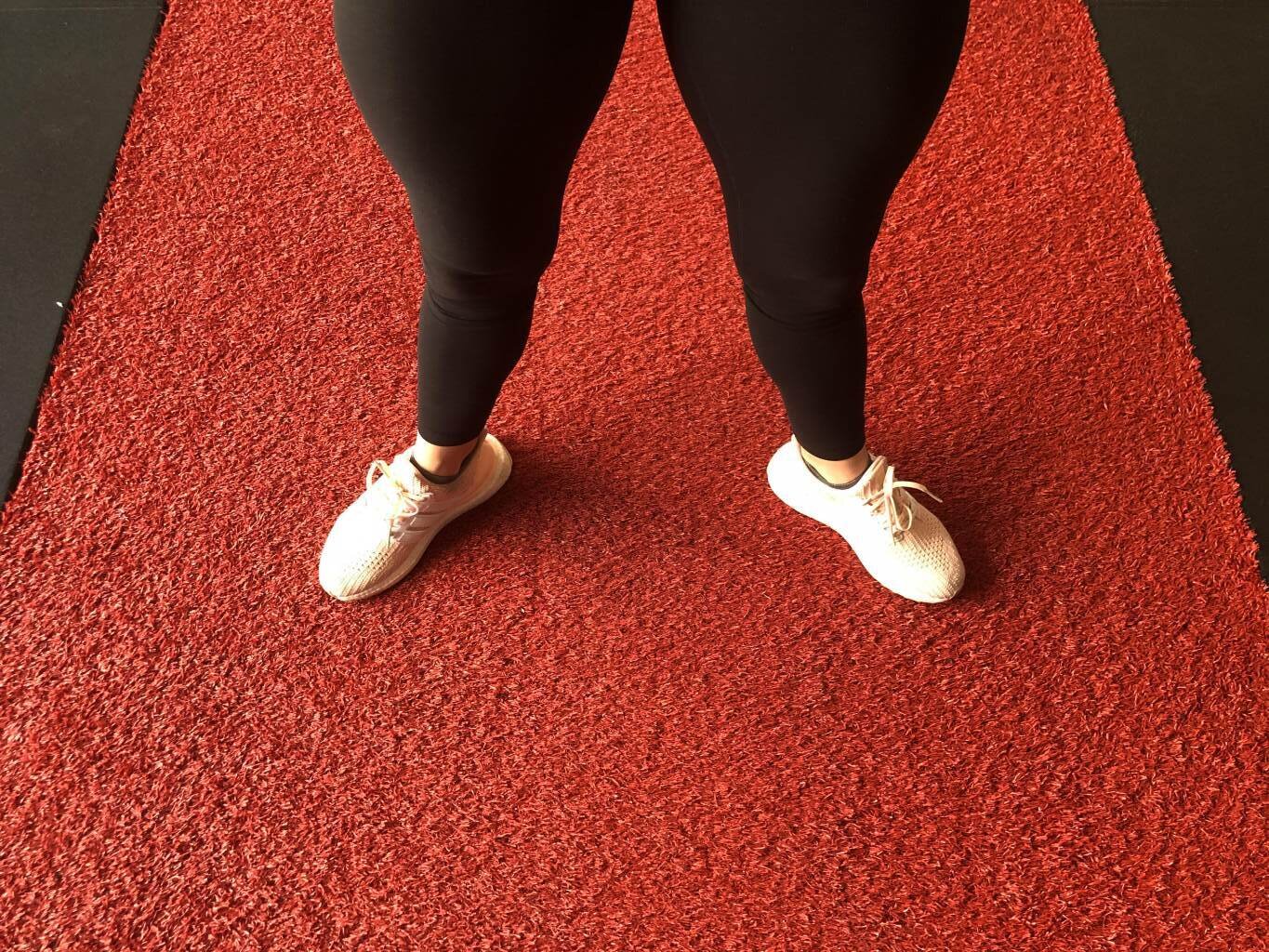 Flare the toes to activate the glutes more while squatting