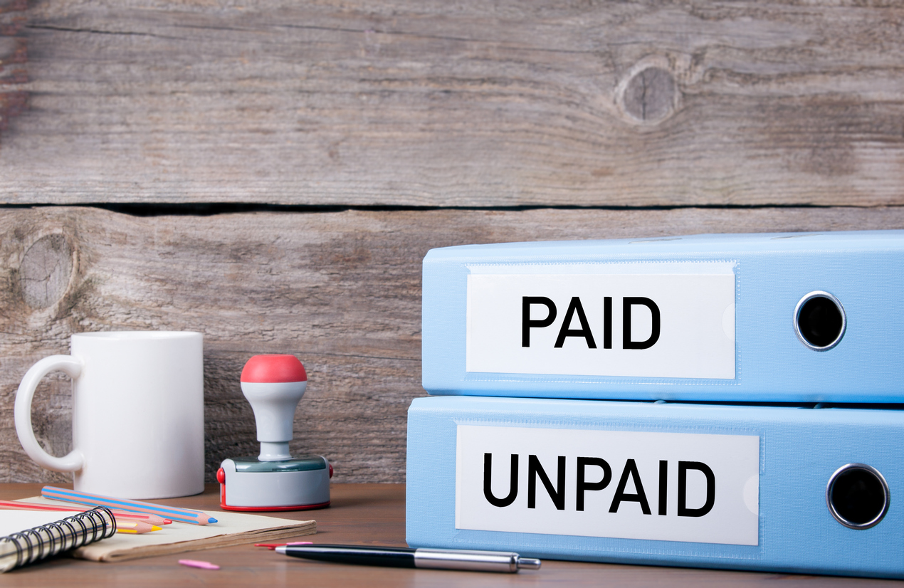 Paid-and-Unpaid.-Two-binders-on-desk-in-the-office-621257150_1273x828.jpeg