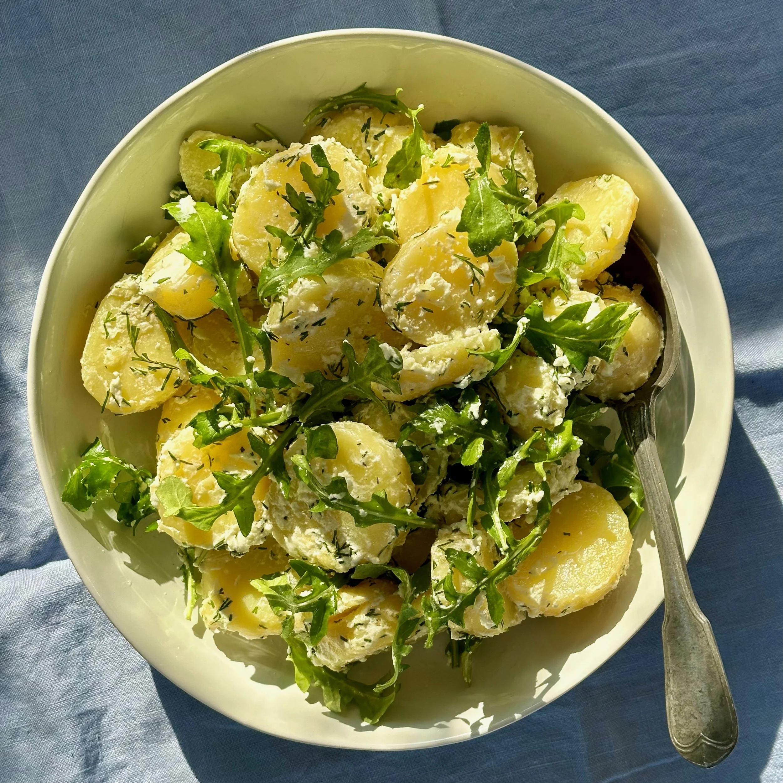 WARM POTATO SALAD WITH GREENS &amp; MARINATED CHEVRE