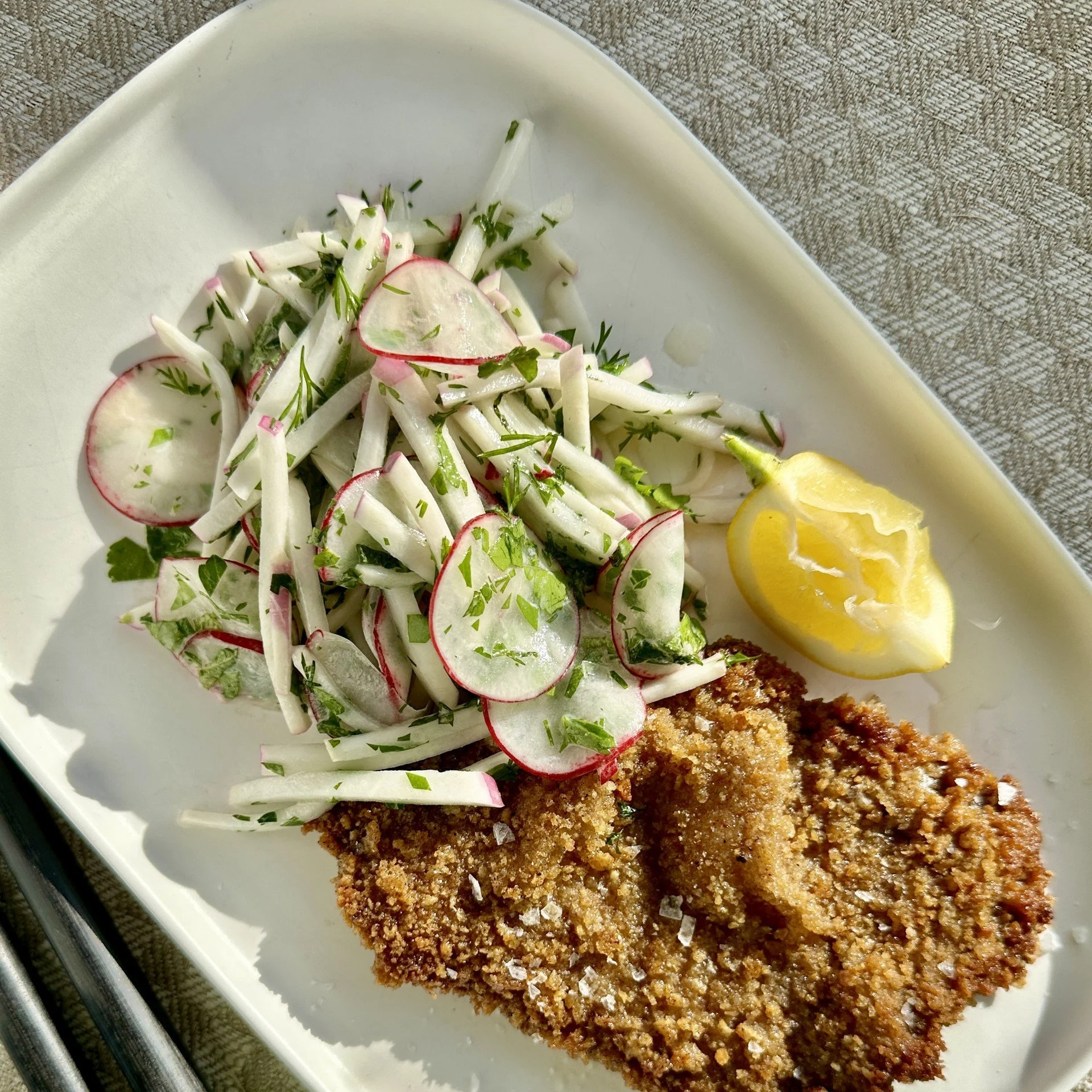 TURNIP &amp; RADISH SLAW WITH CRUMBED BEEF SCHNITZEL