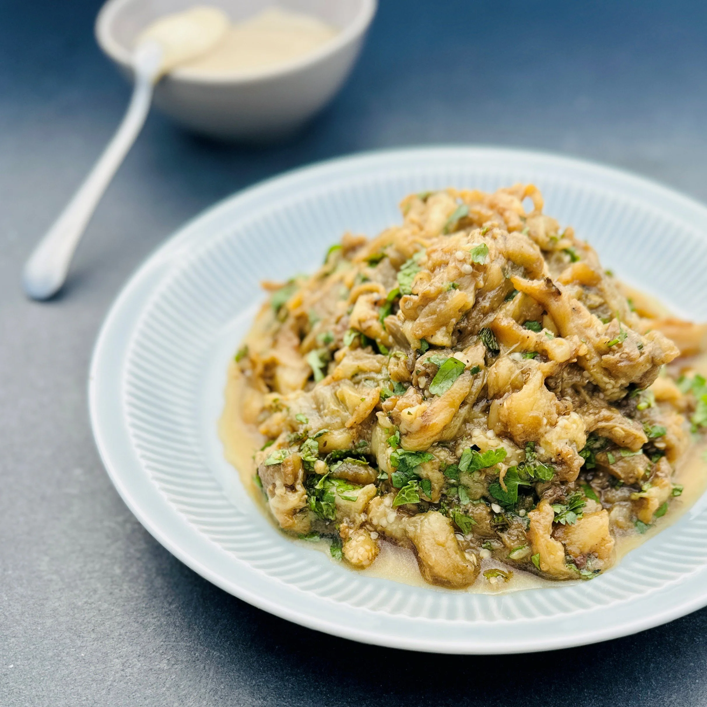 CHARRED EGGPLANT SALAD WITH BLACK GARLIC, HERBS &amp; TAHINI DRESSING