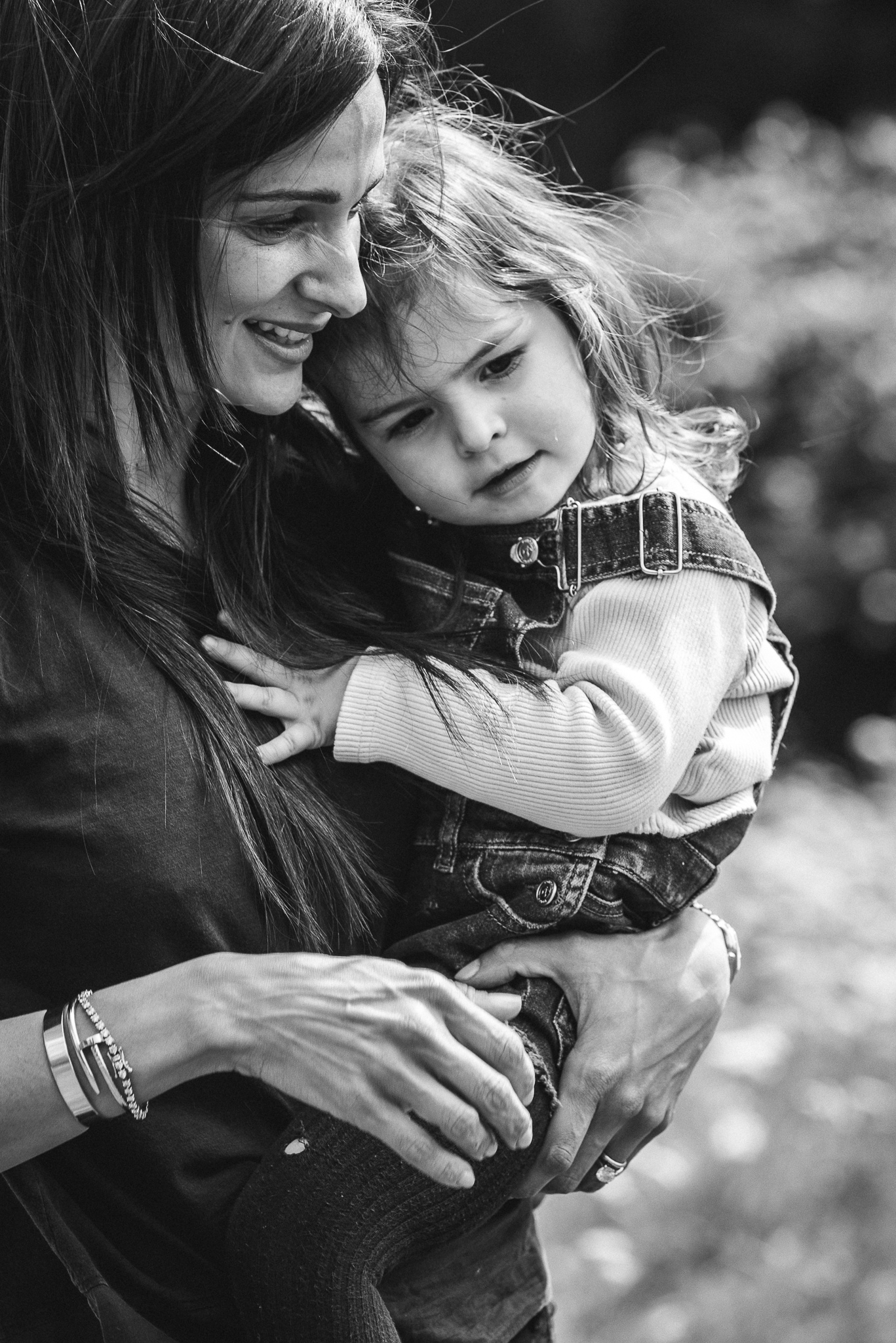 Mother cuddling toddler outdoor photography Cheltenham.jpg