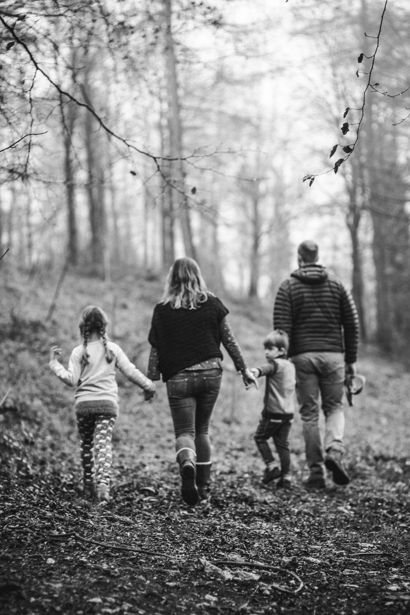 Family exploring woods lifestyle family photographer Cotswolds.jpg