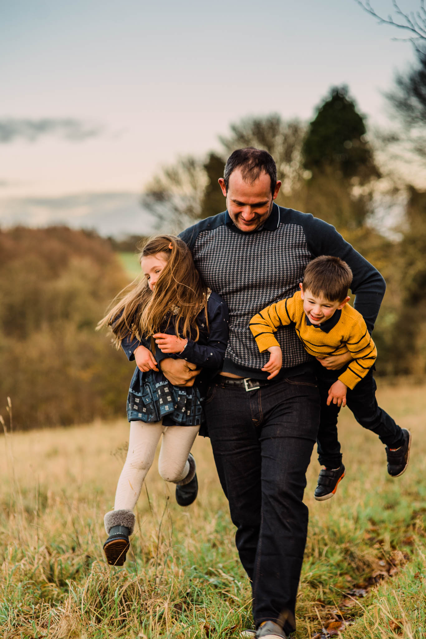 Father carrying children Cotswold Family Photoshoot.jpg