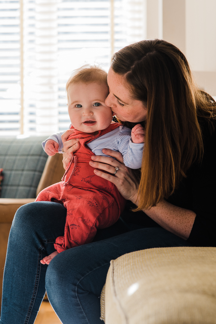 Mother cuddling baby boy in sunny home photoshoot Cheltenham.jpg