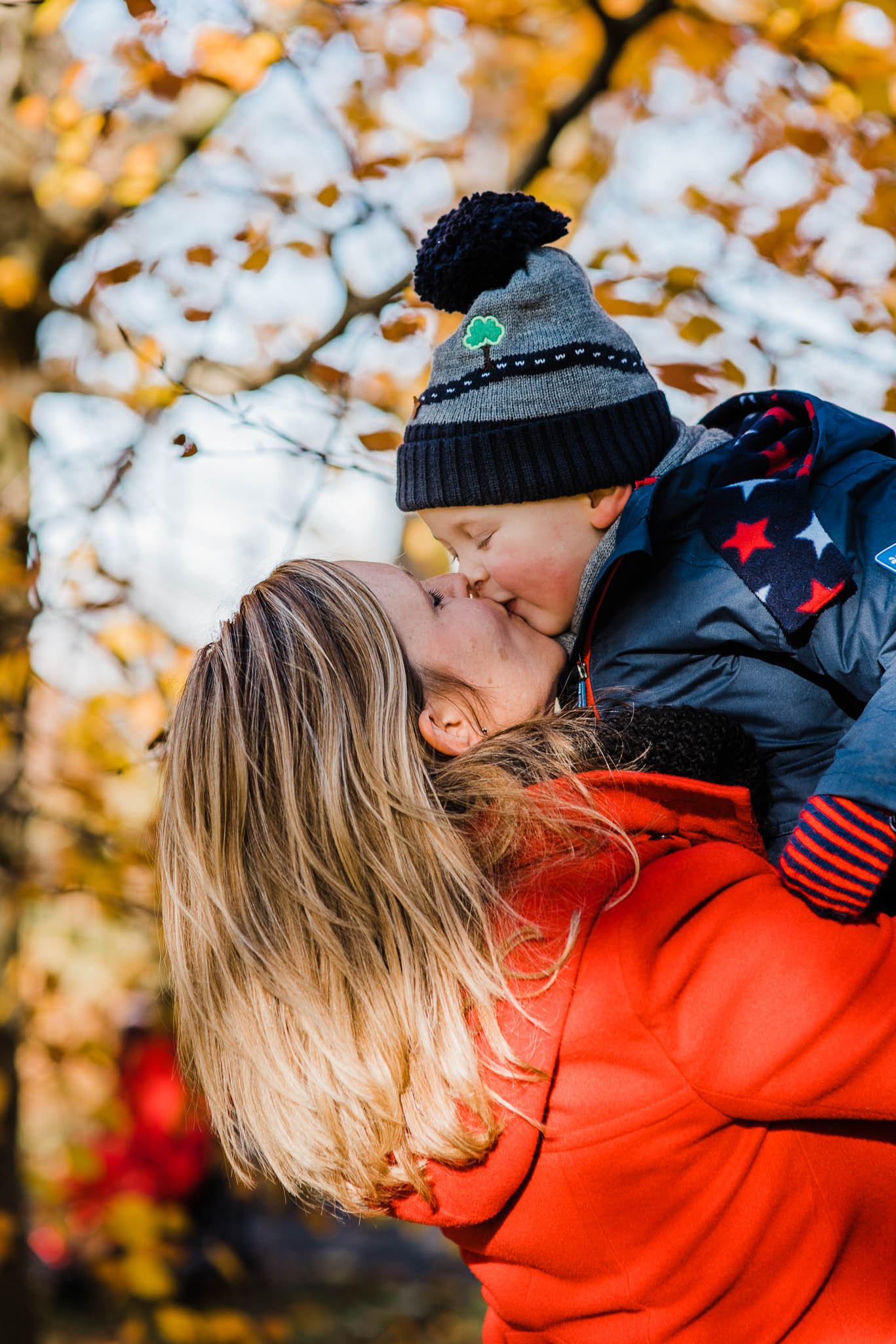 Mother kissing boy toddler in autumn  Cotswold photoshoot.jpg