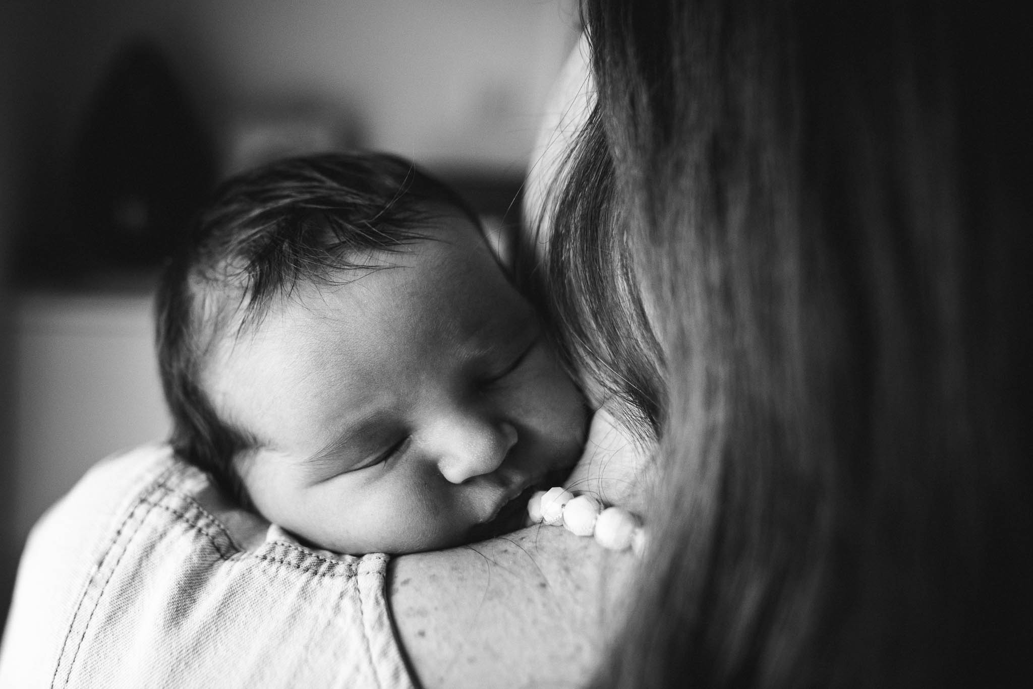Mother cuddling baby boy in home photoshoot.jpg