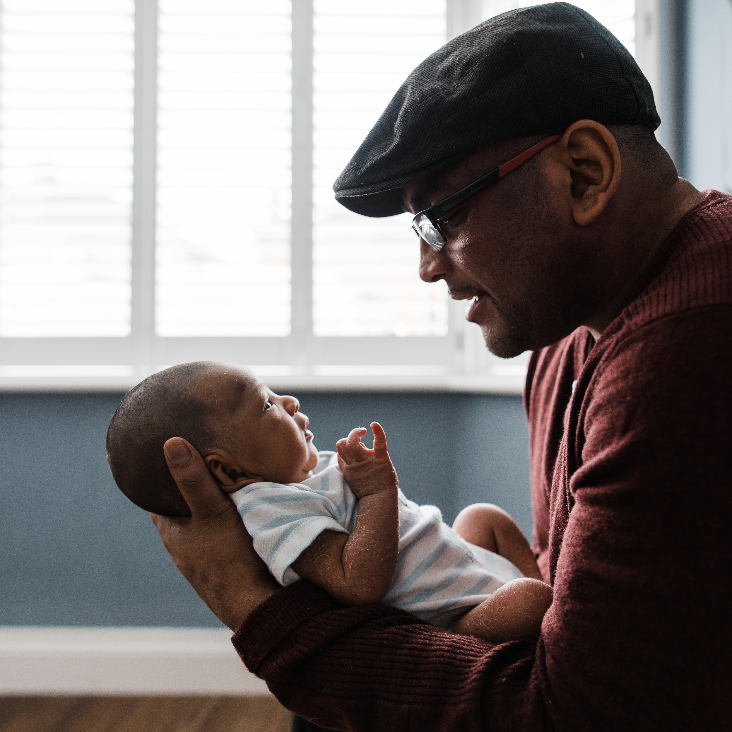 Father and newborn son portrait at home.jpg