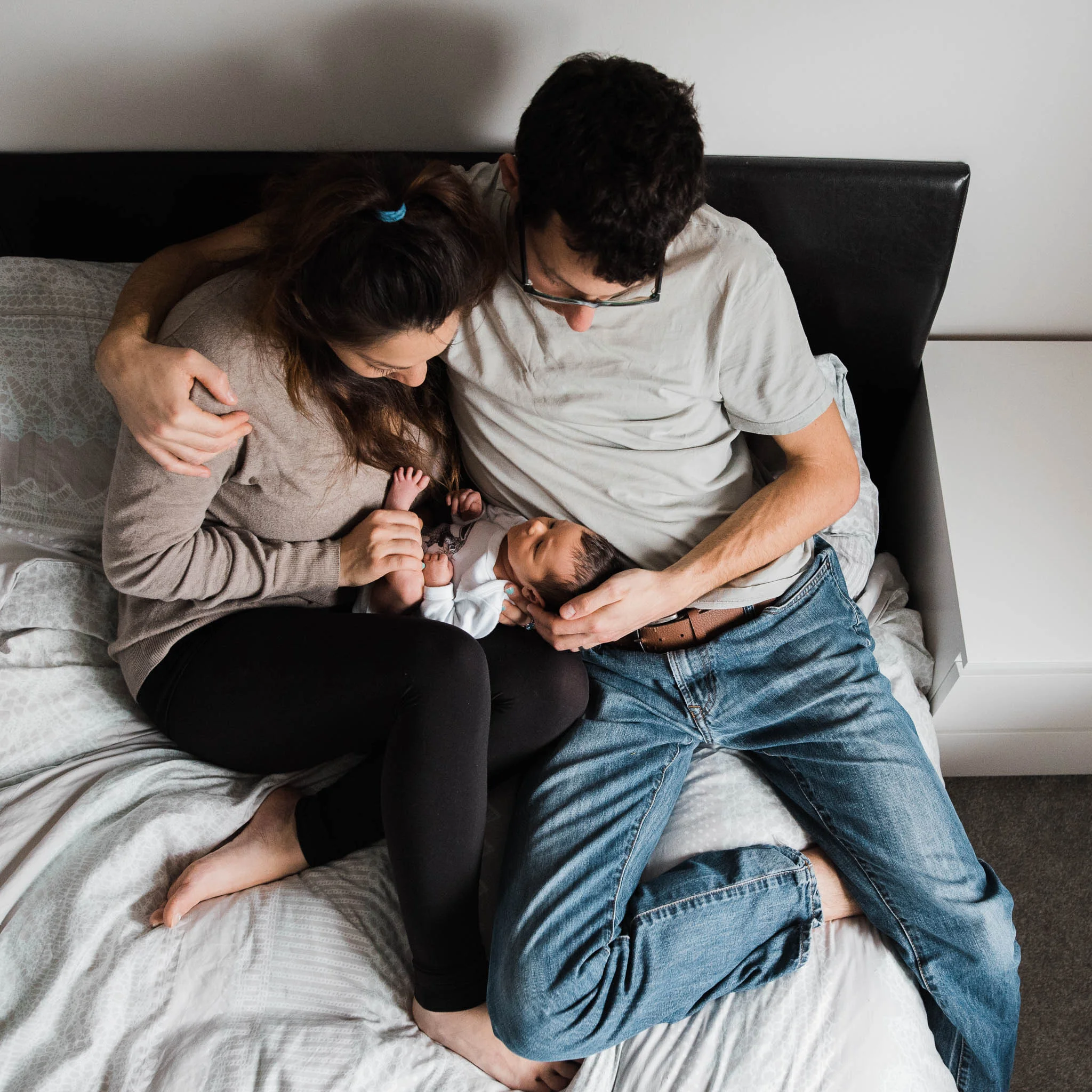 Parents cuddling little newborn baby cheltenham