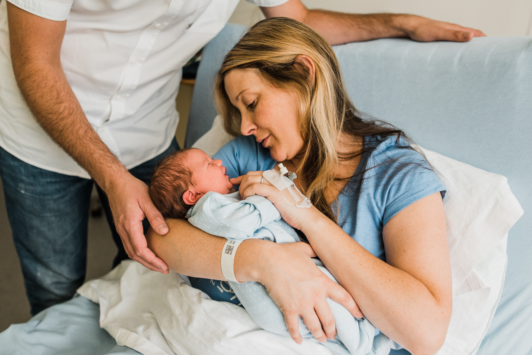 Newborn boy in mothers arms Fresh 48 hospital photoshoot cotswolds.jpg