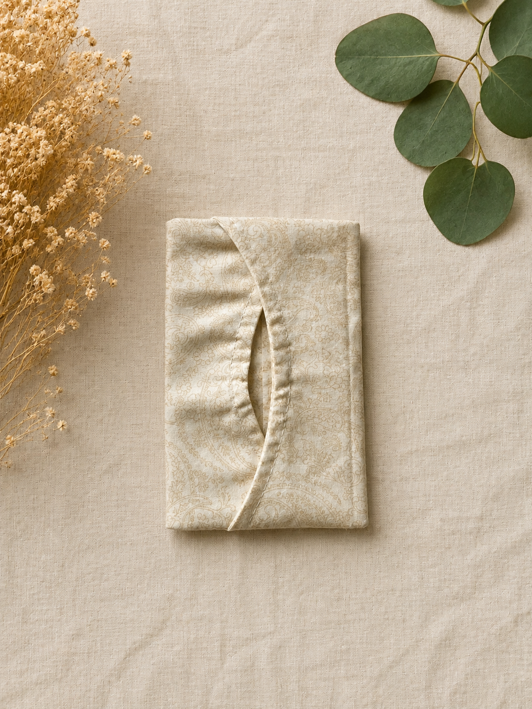 Beige Fabric Pouch with Botanical Accents.png