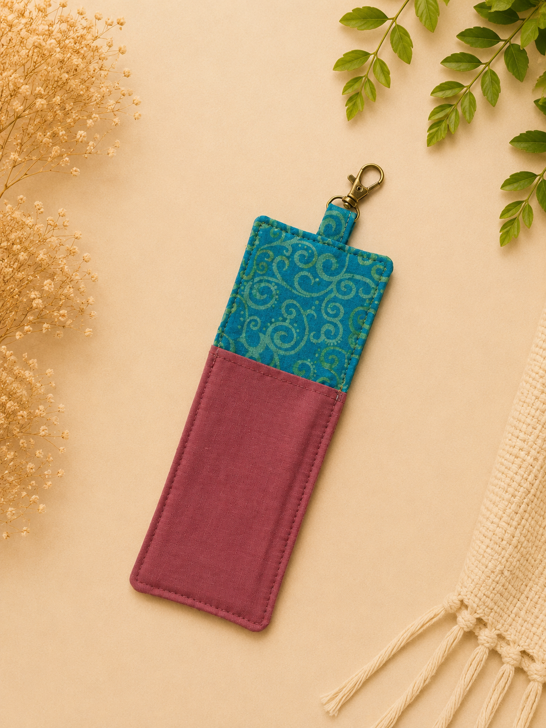 Teal and Mauve Botanical Wristlet Flatlay.png
