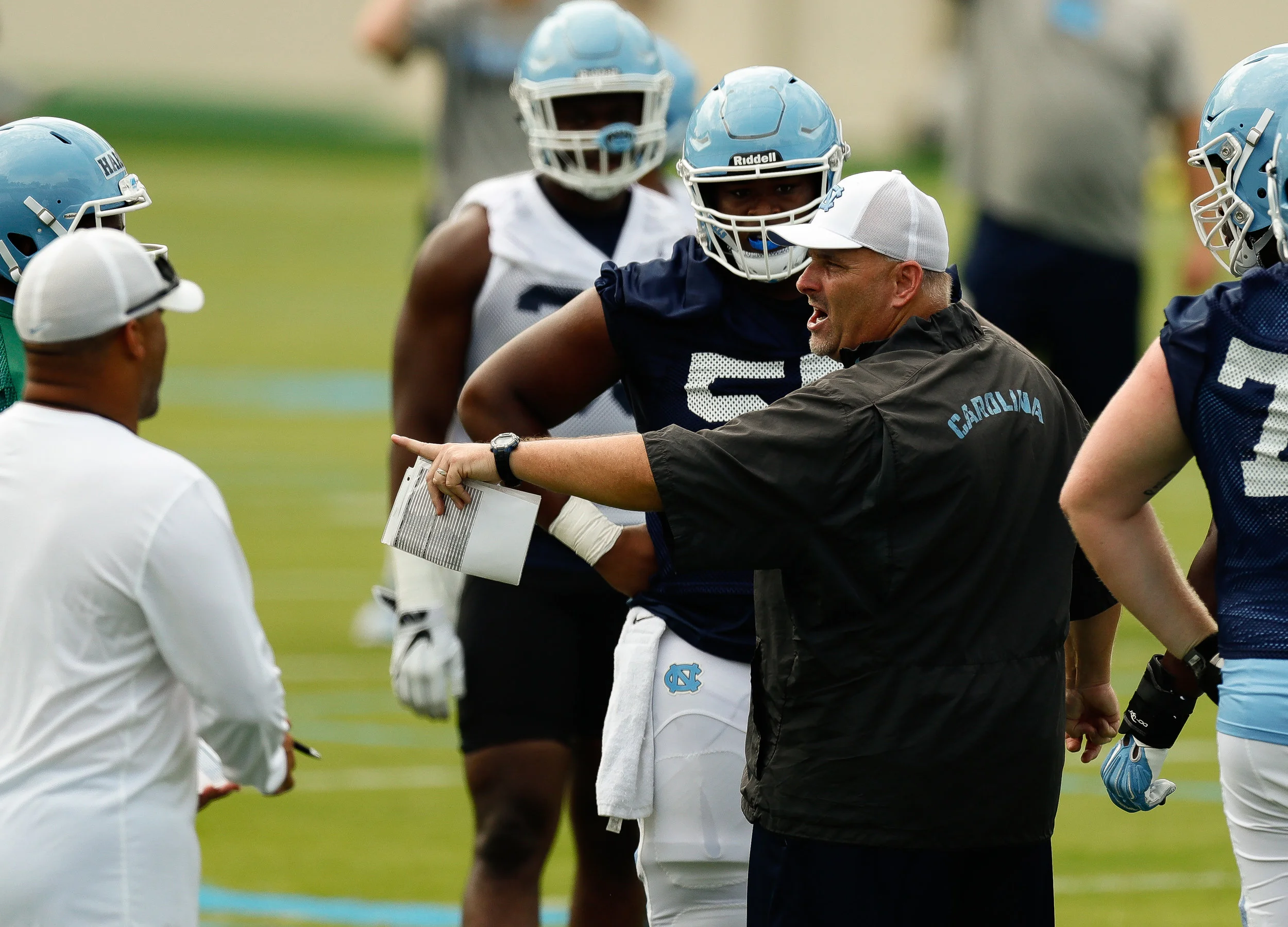 UNC's offensive coordinator and offensive line coach, Chris Kapilovic, will have to fill a hole at guard after Khaliel Rodgers' abrupt retirement. (PC Smith Hardy)