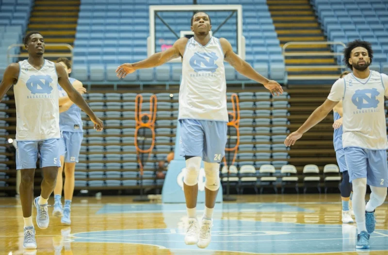 During pre-practice warmups on Feb. 14, Kenny Williams (center) felt a familiar pain in his right knee.