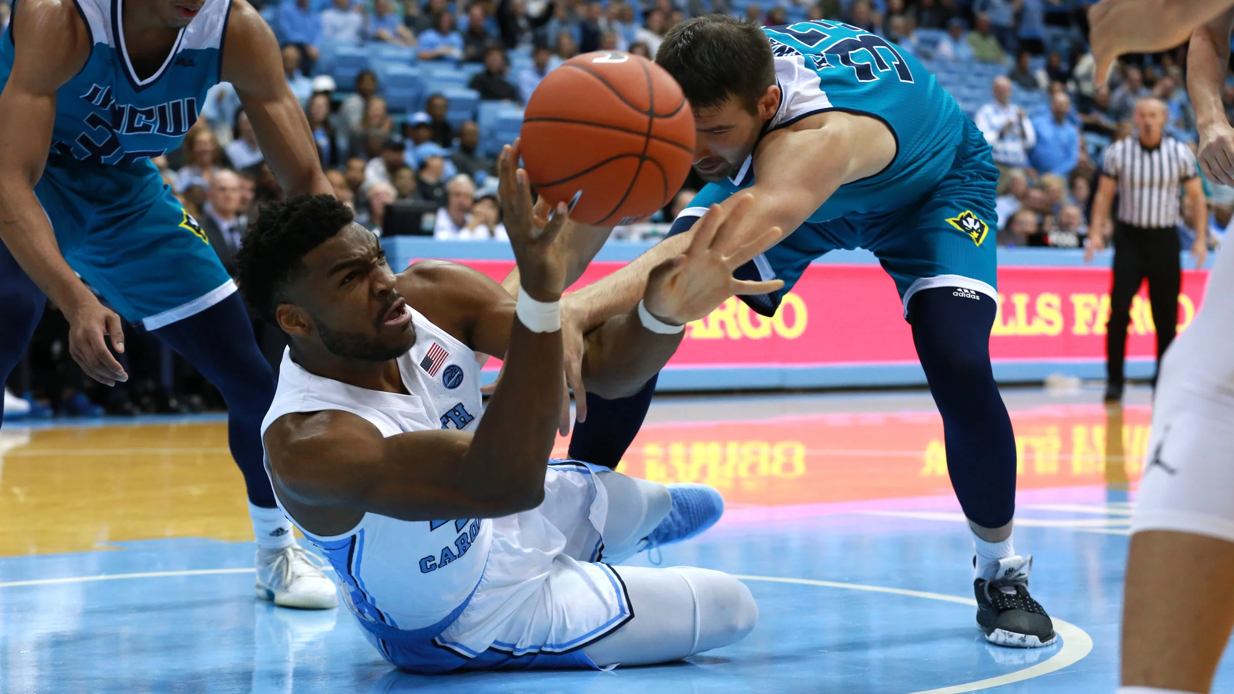 Brandon Huffman scraps for the ball during the barrage of biscuit three pointers at the end of the game. | Photo by Alex Kormann