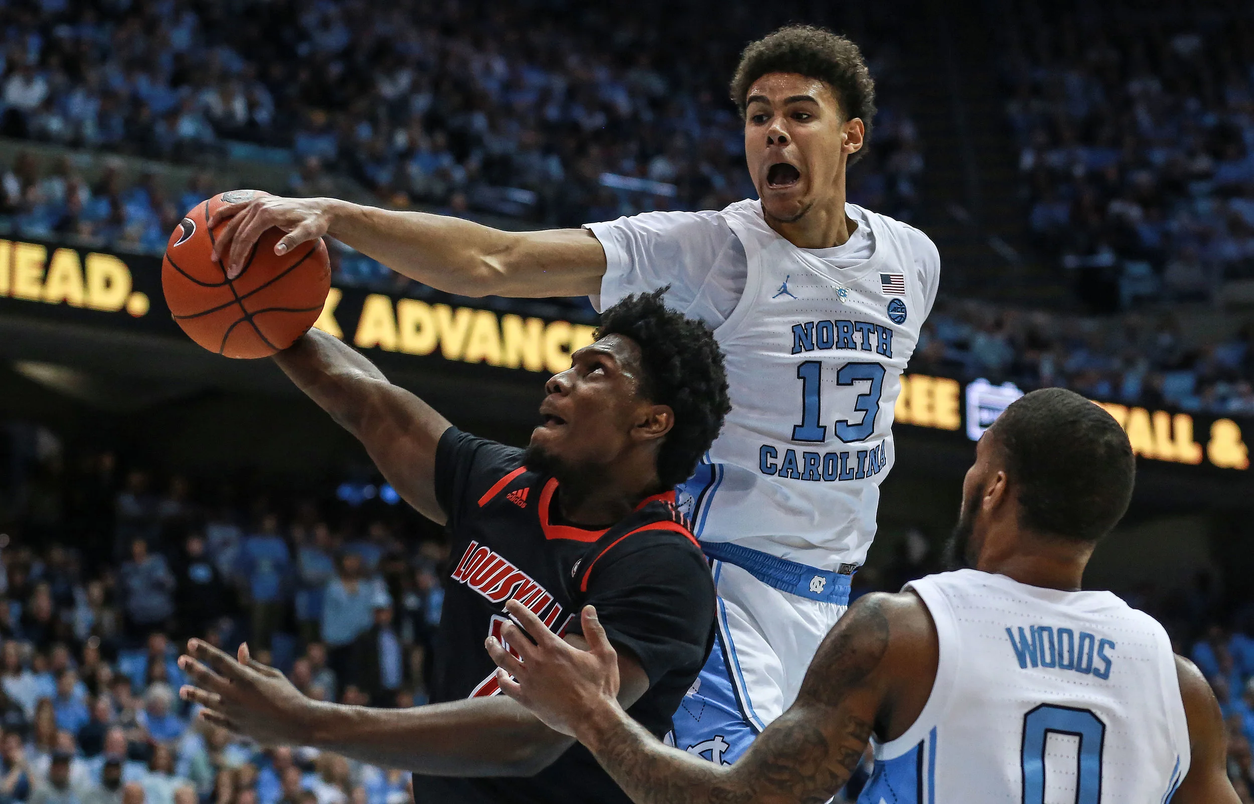 Cameron Johnson goes in for a block during Saturday’s loss to Louisville. The graduate transfer forward scored ten points against the Cardinals, but failed to drain a three for the first time this season. | Photo by Alex Kormann