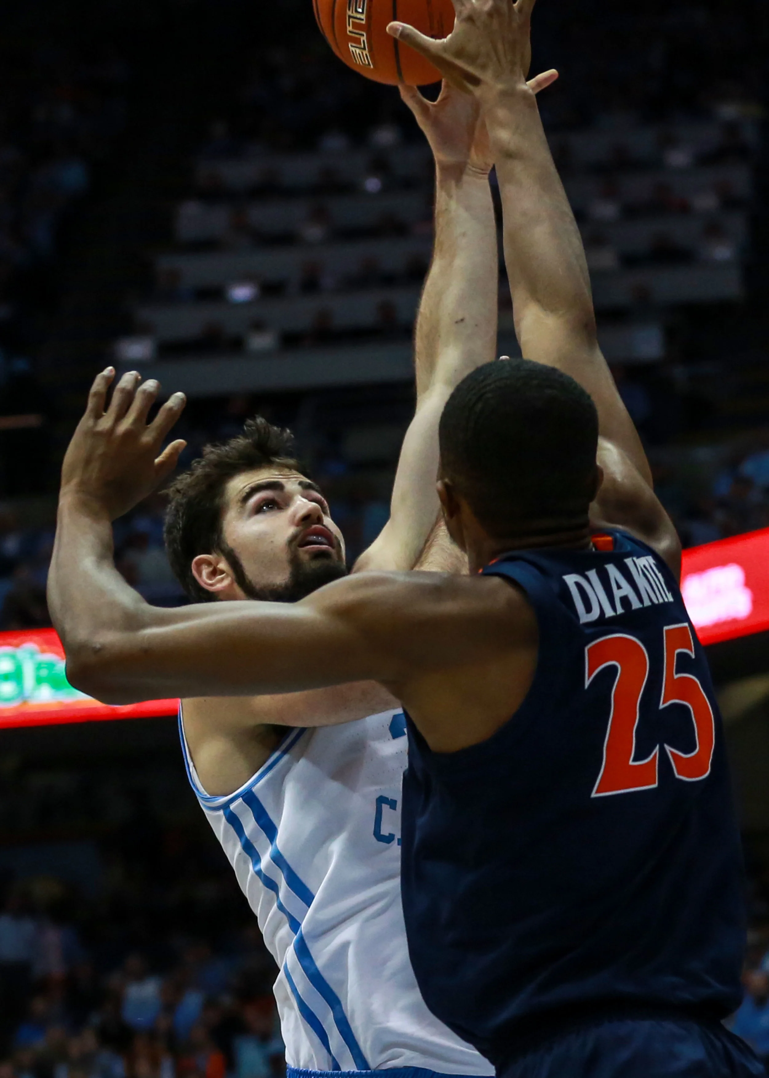 Luke Maye goes up for a shot against UVA’s Mamdi Diakite. The senior forward struggled against the Cavaliers, scoring just four points on 2-of-10 shooting. | Photo by Alex Kormann