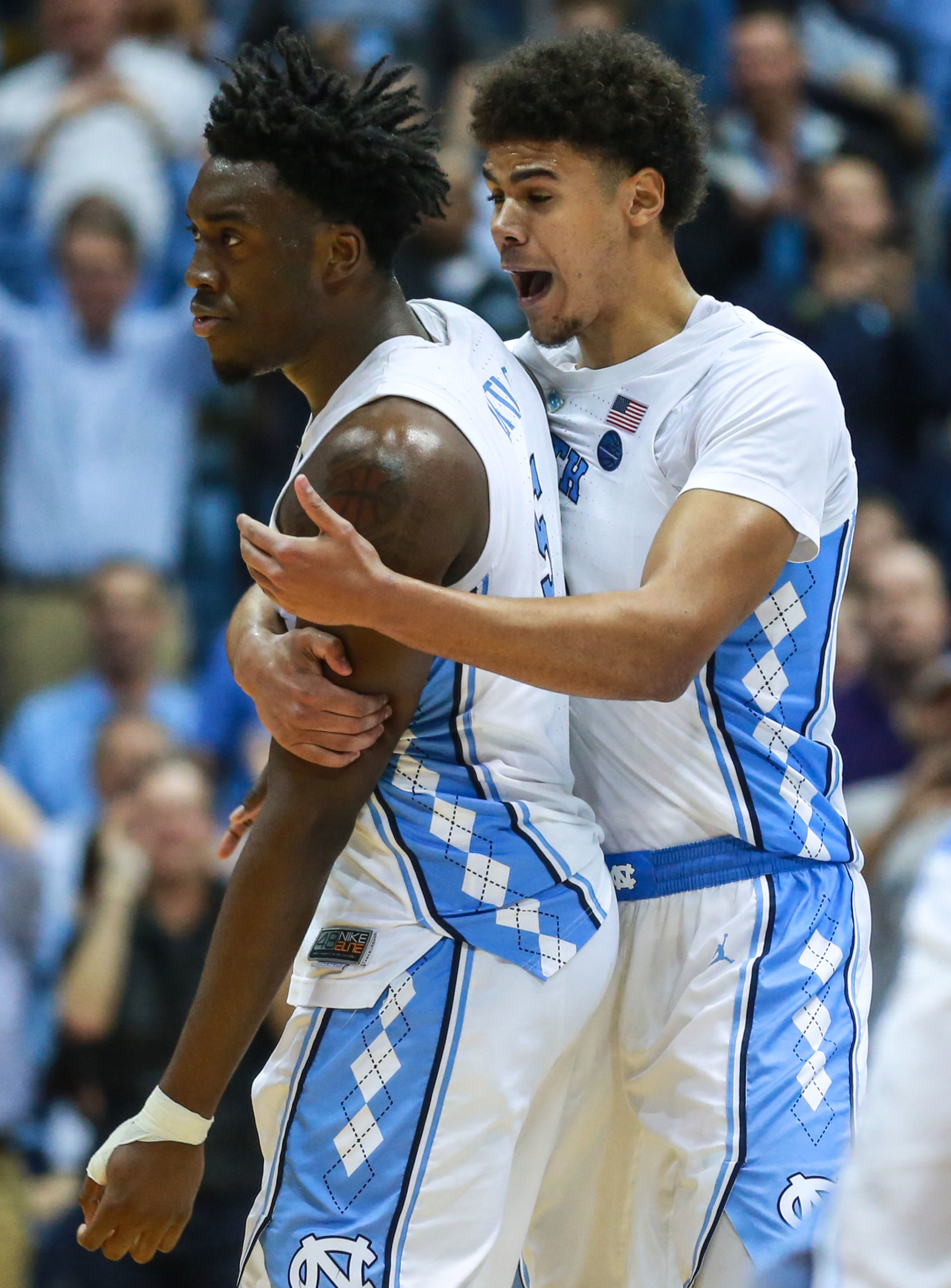 Cameron Johnson hypes up Nassir Little after an And-1 bucker during UNC’s win over FSU. The graduate transfer and freshmen tied for the lead in points for UNC, each bringing in 18 over the course of the afternoon. | Photo by Alex Kormann