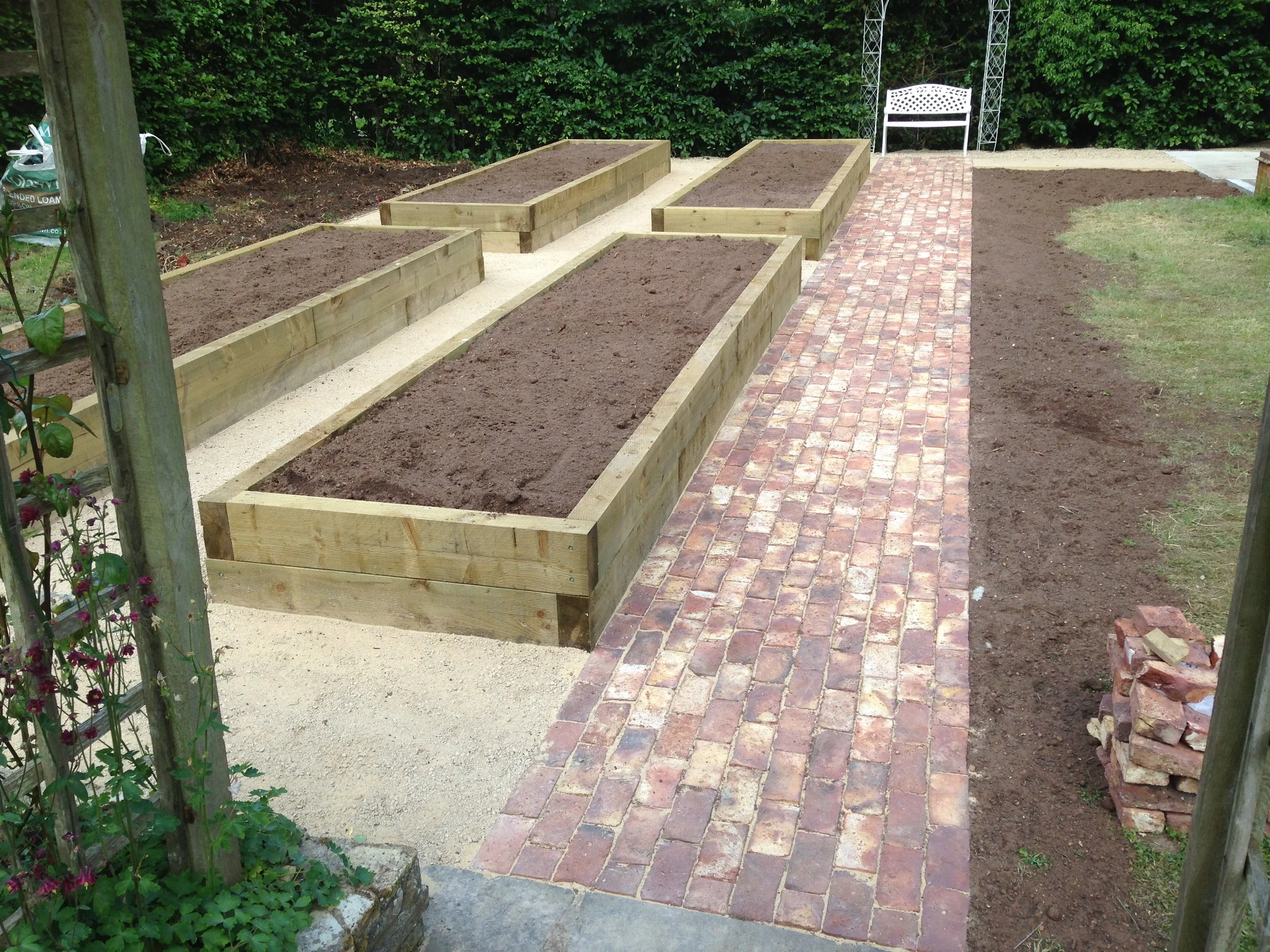 Sleeper beds and block paved path, Guildford