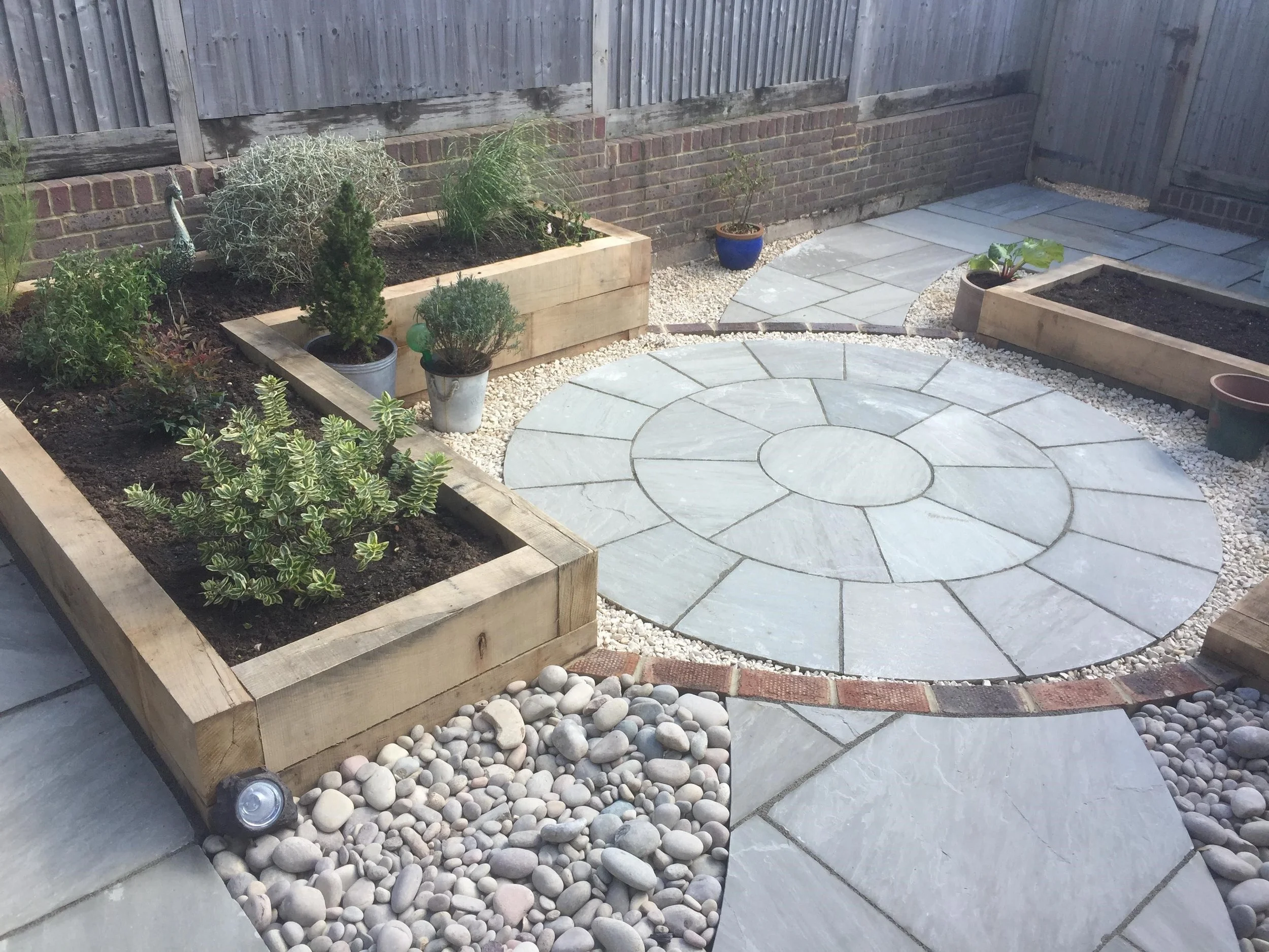 Raised sleeper beds and paving circle, Roedean