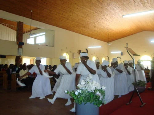 The women dance and sing at St. James