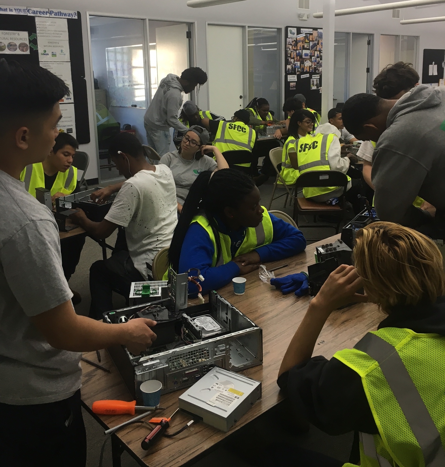 As part of Techology and Innovation Workshops, Corpsmembers take apart a computer. 
