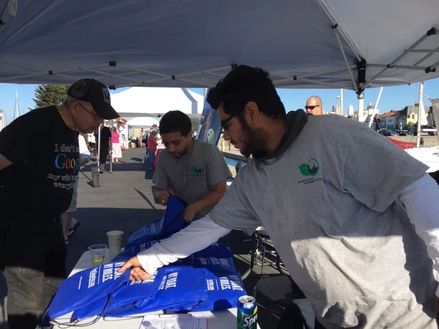 Frank and John handing out boater kits. 