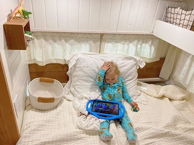 This is exactly what parenting looks like when mom and dad are trying to wrap up bus projects. All the dinosaurs, @blippi on the iPad, and cozy comfy pillows and blankets. #dontjudge #bekind #diy #tinyhouse #vanlife #buslife