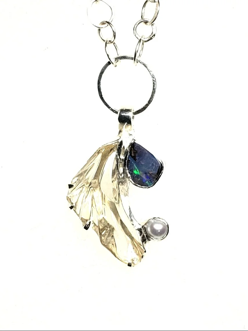 Sunstone Carving with Opal and Pearl