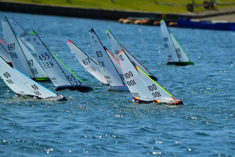 Radio yachts sailing upwind (beating) during a regatta.