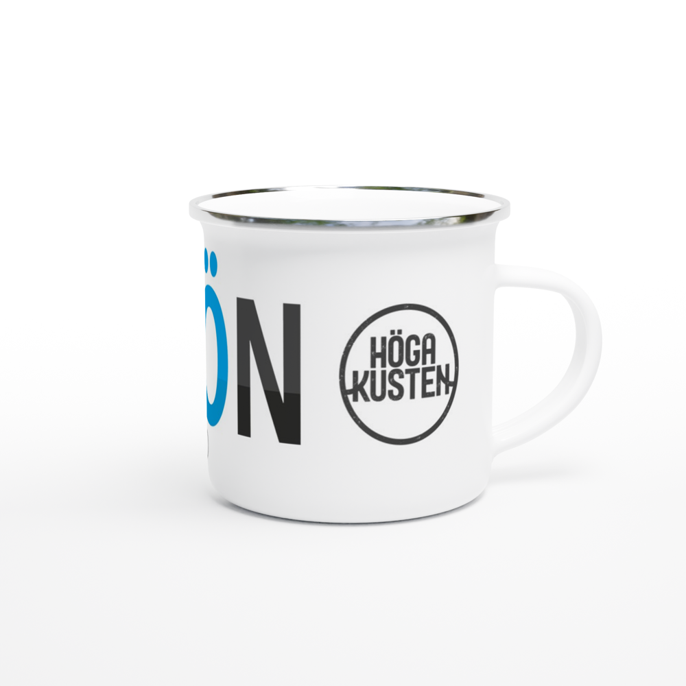 The picture shows a right side view of the 12oz white enamel mug "#ULVÖN Höga Kusten" from the series HIKING #TAGMUG™