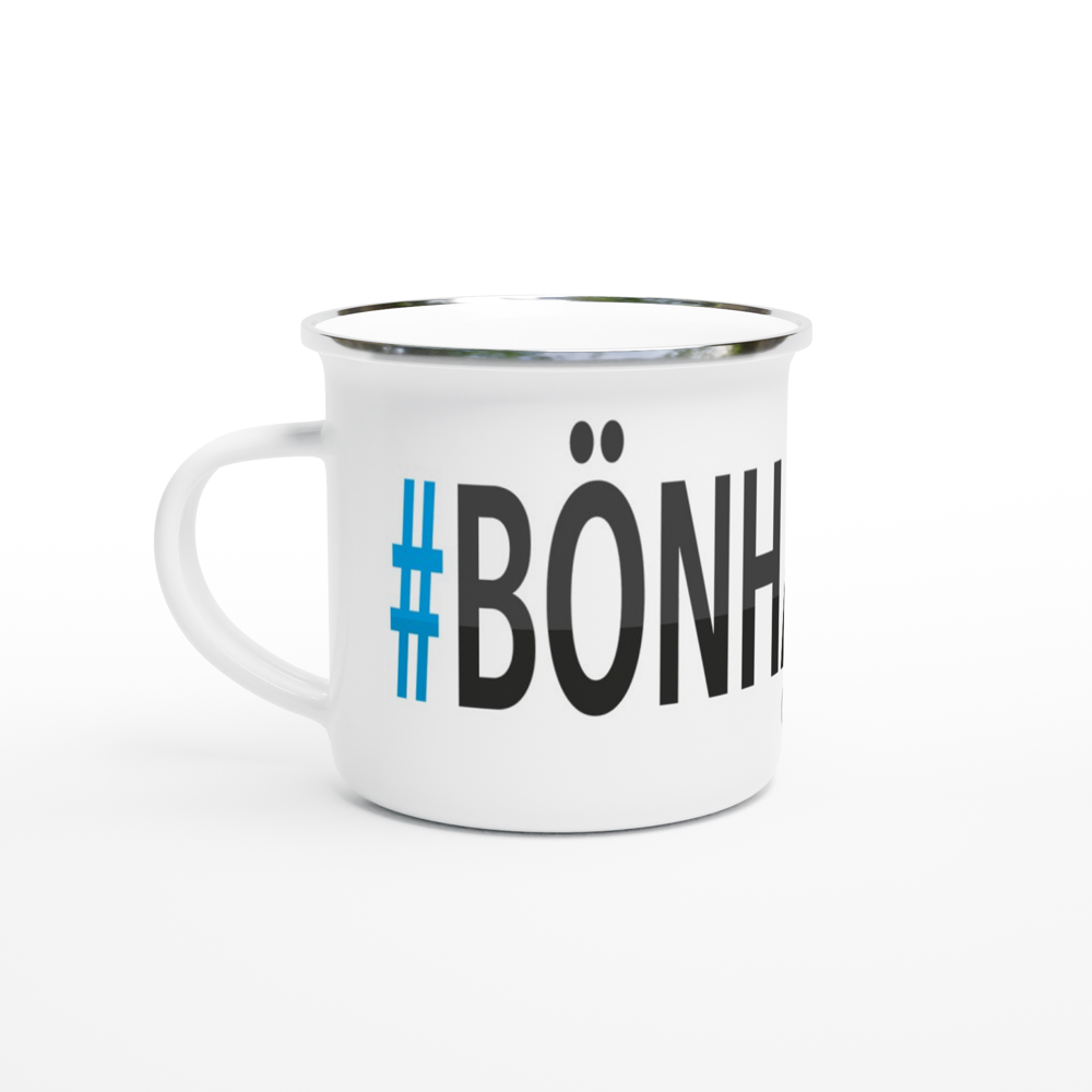 The picture shows a left side view of the 12oz white enamel mug "#BÖNHAMN Höga Kusten" from the series HIKING #TAGMUG™