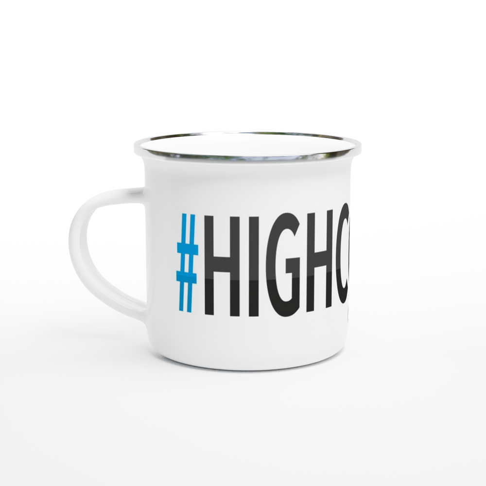 The picture shows a left side view of the 12oz white enamel mug "#HIGHCOAST Höga Kusten" from the series HIKING #TAGMUG™