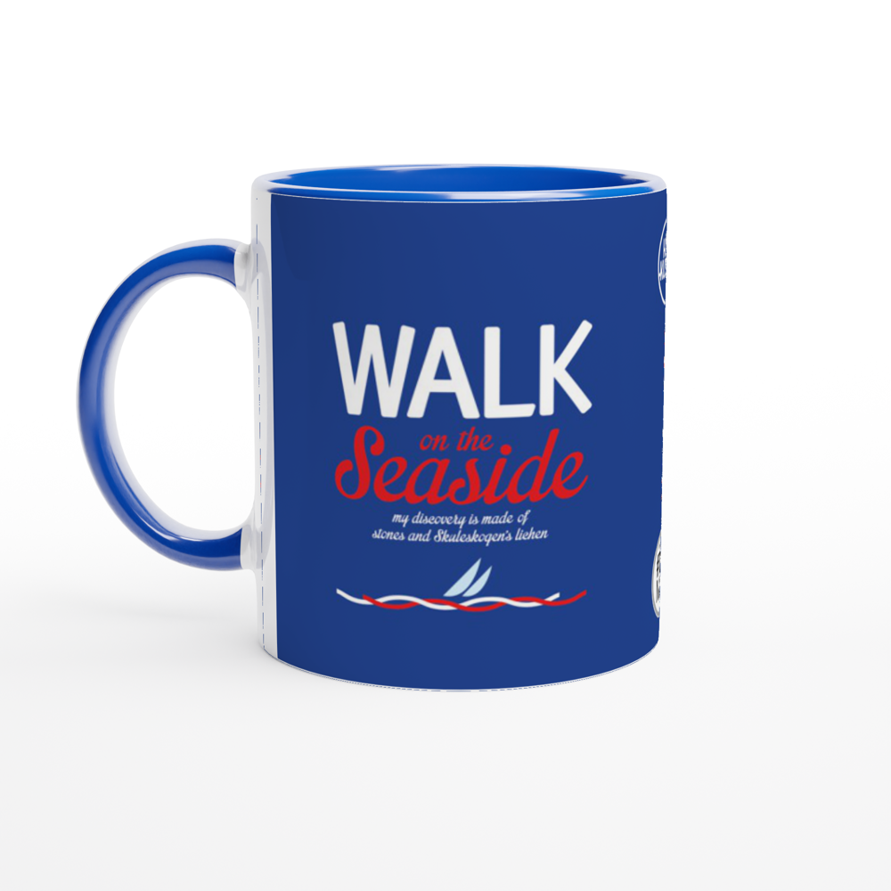The picture shows a right side view of the 11oz ceramic mug "WALK ON THE SEASIDE" from the series HIGH COAST SAILOR #TAGMUG™ with blue color inside