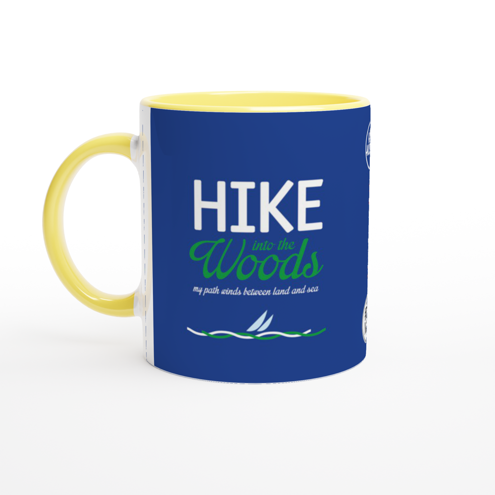 The picture shows a right side view of the 11oz ceramic mug "HIKE INTO THE WOODS" from the series HIGH COAST SAILOR #TAGMUG™ with yellow color inside