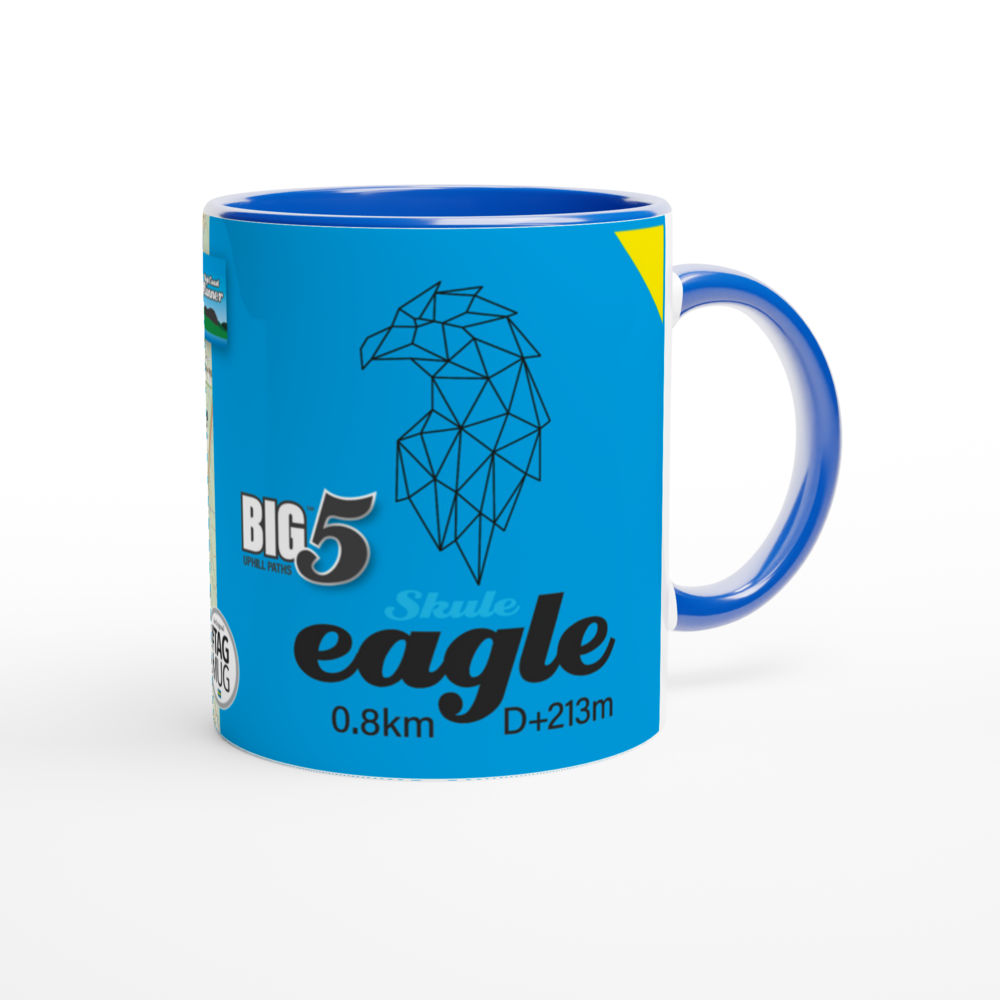 The picture shows a right side view of the 11oz ceramic mug "SKULEBERGET EAGLE PATH" from the series “SKULE BIG5" #TAGMUG™ with blue color inside