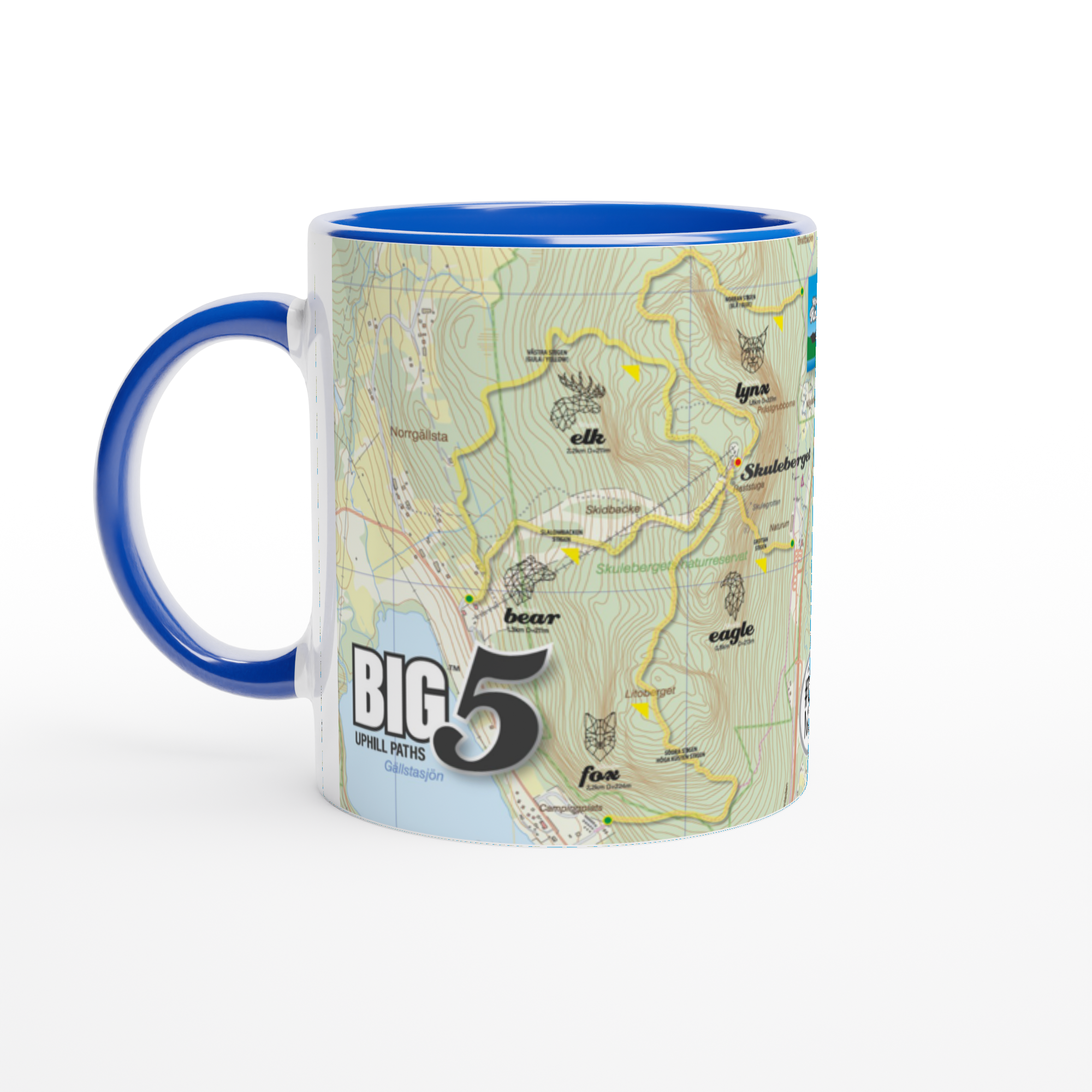 The picture shows a right side view of the 11oz ceramic mug "SKULEBERGET FOX PATH" from the series “SKULE BIG5" #TAGMUG™ with blue color inside