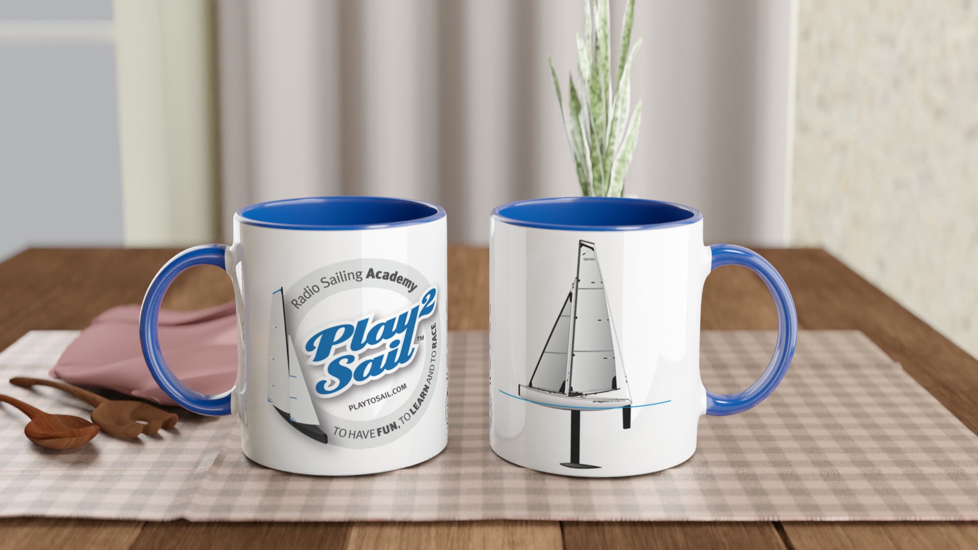 The picture shows the left and right side view of two 11oz ceramic mugs "RADIO SAILING ACADEMY" from the series PLAY2SAIL #TAGMUG™ with blue color inside