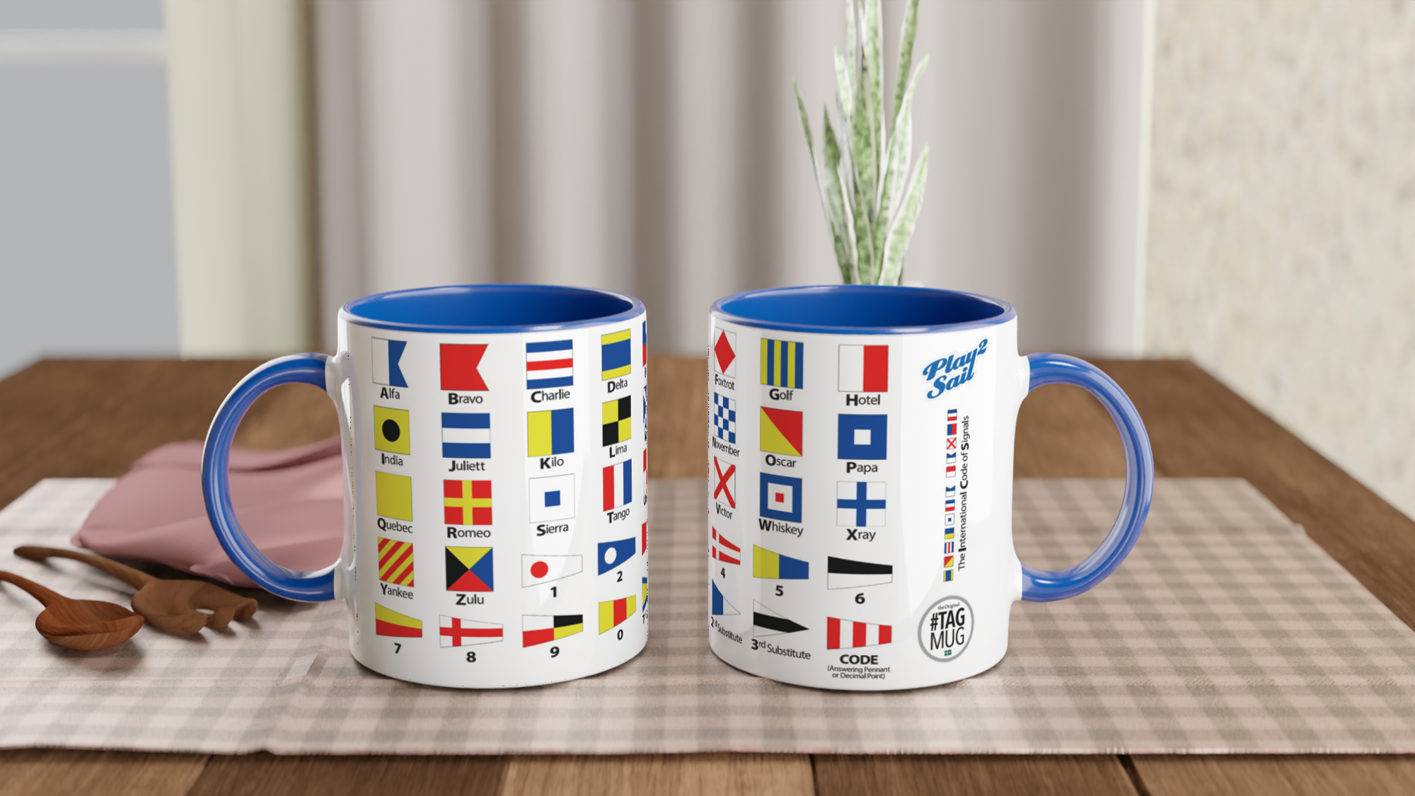 The picture shows the left and right side view of two 11oz ceramic mugs "NAUTICAL FLAGS of the I.c.S.” from the series SAILING #TAGMUG™ with blue color inside