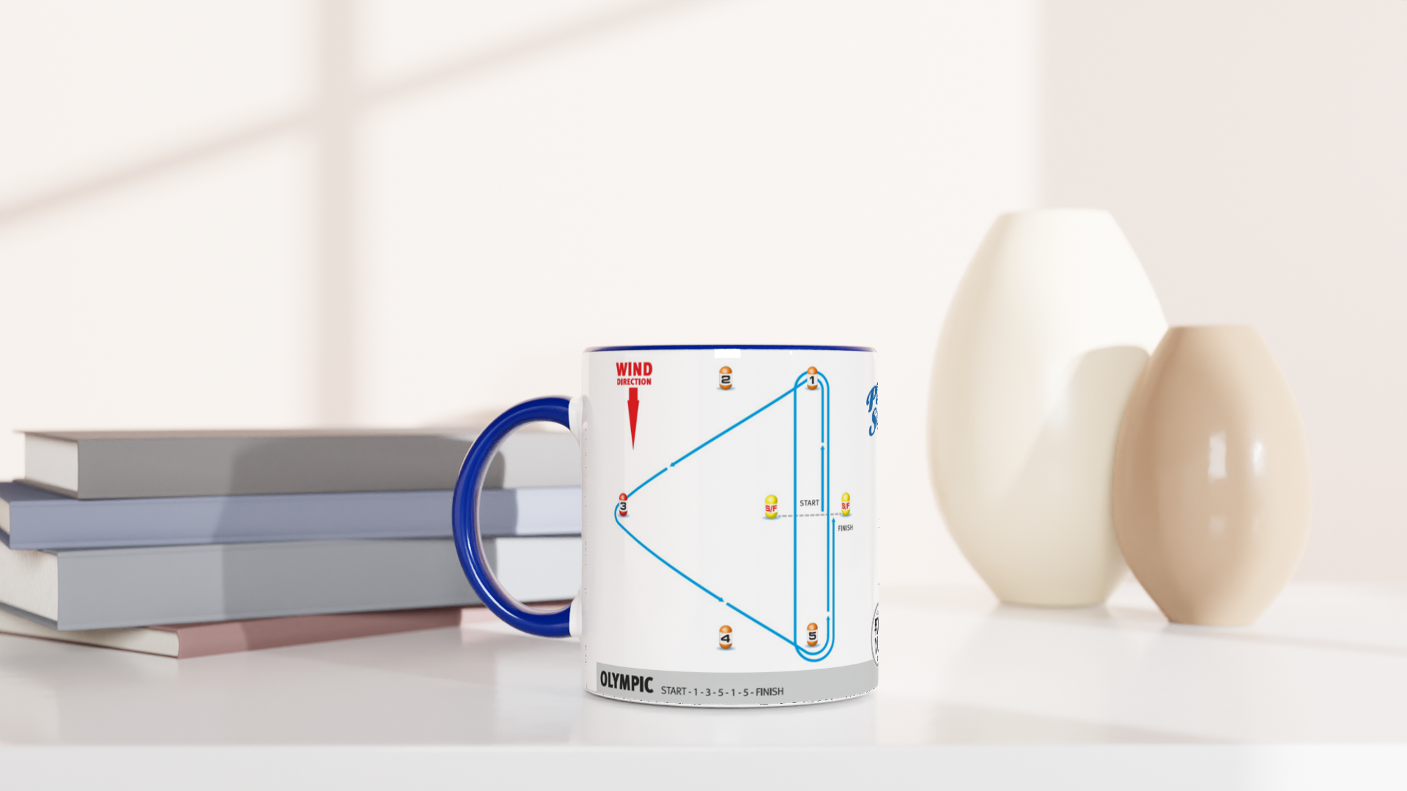 The picture shows a left side view of the 11oz ceramic mug “SAILING COURSES 1” from the series “Play2Sail: Radio Sailing Academy #DF65” [#TAGMUG™] with blue color inside on a desktop